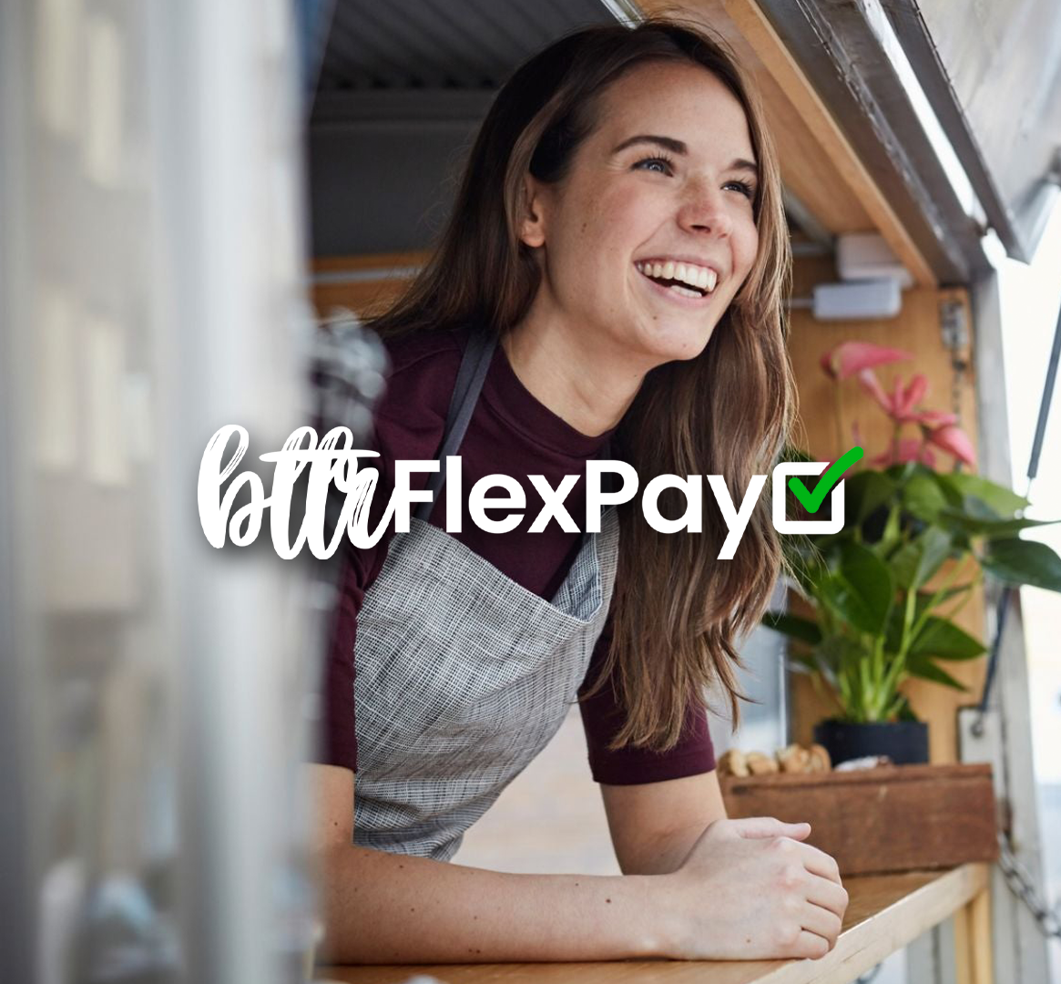 Small business owner smiling at food truck, promoting BTTR FlexPay easy monthly payments for websites and marketing